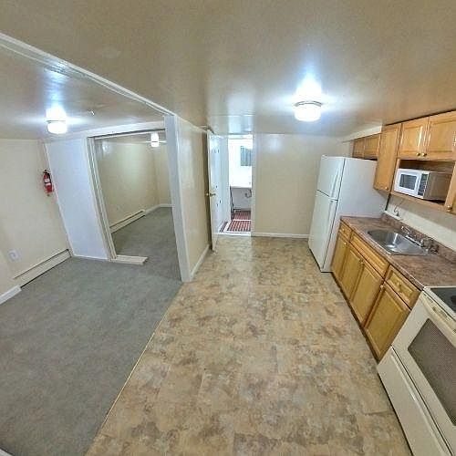 Kitchen, bedroom, and lounge area - empty