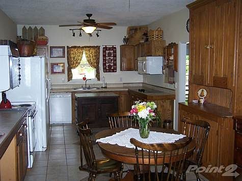 Large Open Kitchen with Eat in Area and Plenty of Cabinets