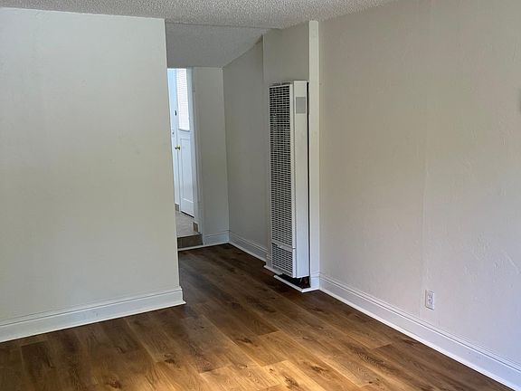 New wall heater, freshly painted, and new floors