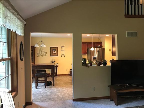 The living room leads conveniently into the bright and sunny kitchen.