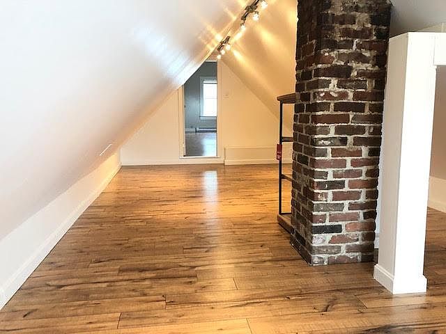 New bedroom, with wooden floor and bricks