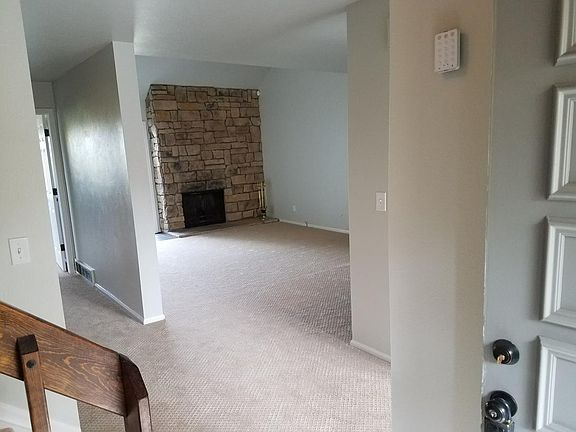Living room with wood burning fireplace
