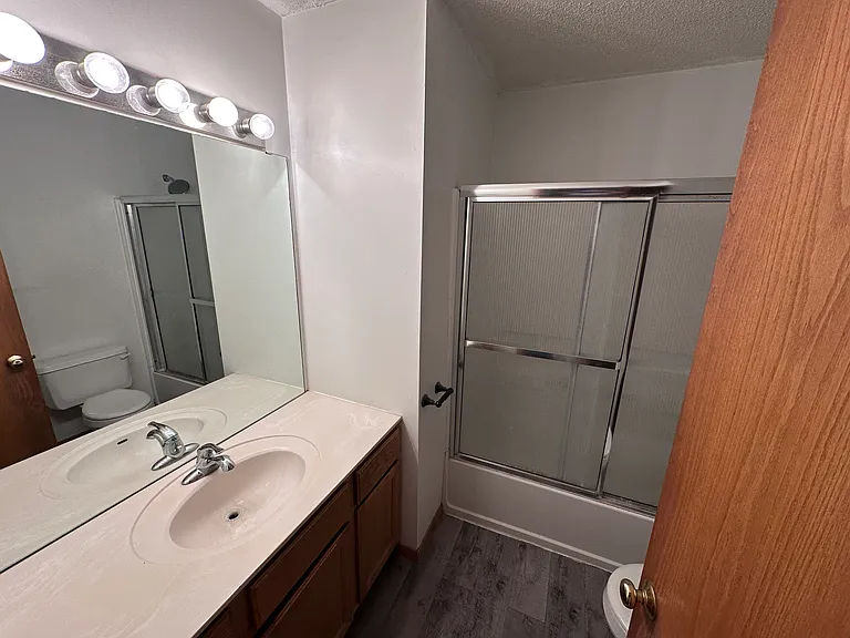 Full bath with extended vanity and tub-shower