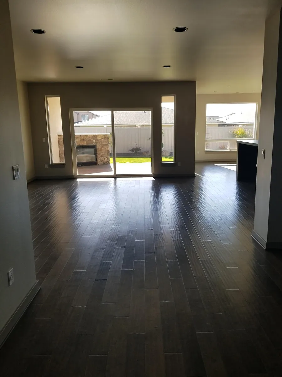 View of Great Room from the front door hallway. Large living room/great room with fireplace. - 306 E Chason Ave