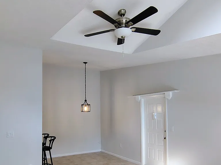 Dining room by entry door, new ceiling fan over LR