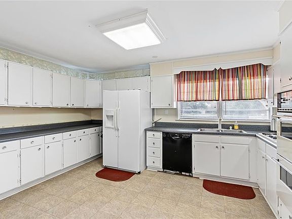 Kitchen with white cabinets.