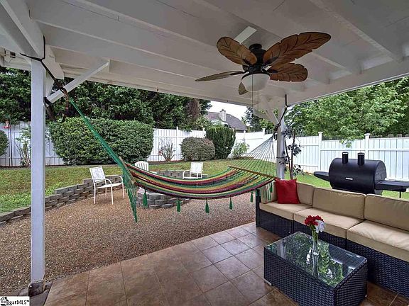 Covered Porch with Tiles and Ceiling Fan