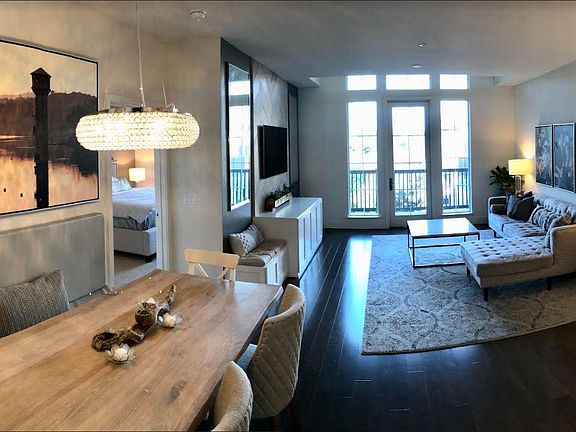 Open space layout, custom built-in banquet dining, built in media cabinet with ample storage