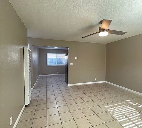 As you enter the unit, a view of the dinette area, wall heater and living space. The place lends itself to very good air flow.