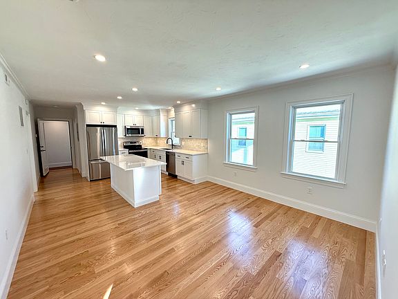Kitchen: Brand New Stainless Steel Appliances, Quartz Countertops with Open Layout into Living Area