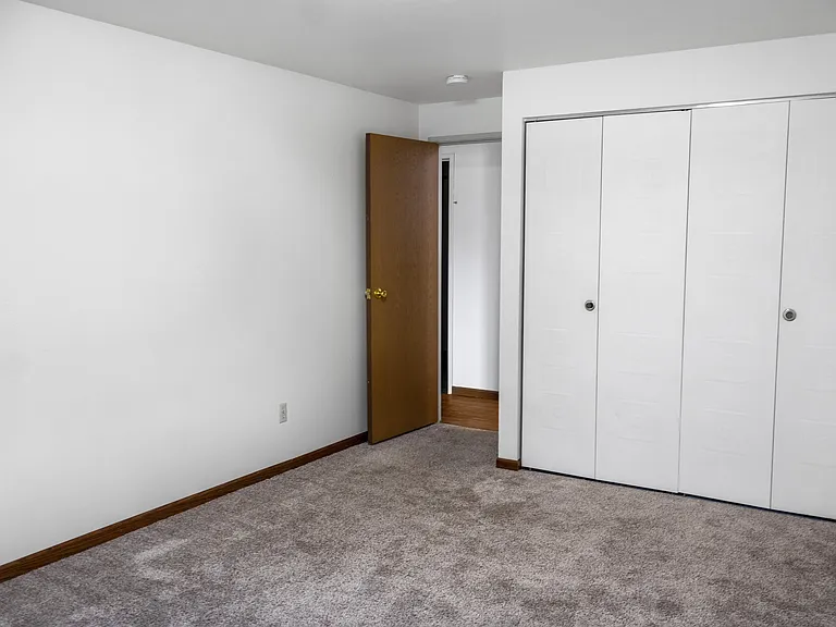 Transform your living space at The Gallery with this spacious bedroom, featuring plush carpeting and ample closet space. This room offers the perfect blank canvas for your personal touch. Schedule a tour today to envision your future here!