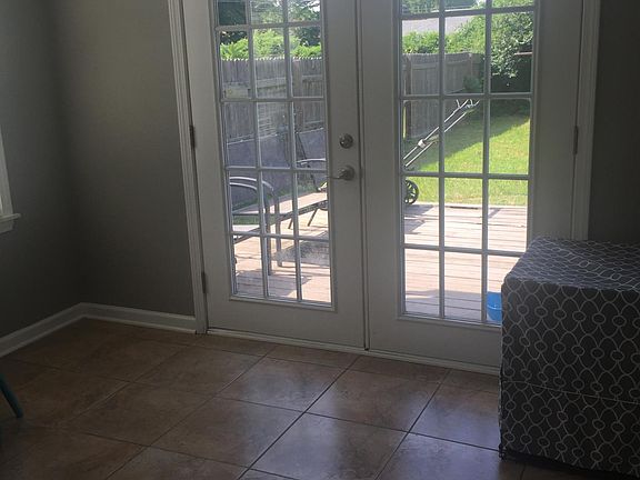 The Sunroom opens to a deck and a fenced in backyard.