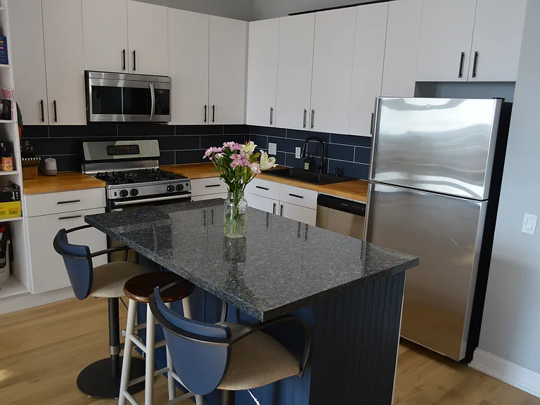 Kitchen boasts 42" cabinets and large island, perfect for all of your storage needs.