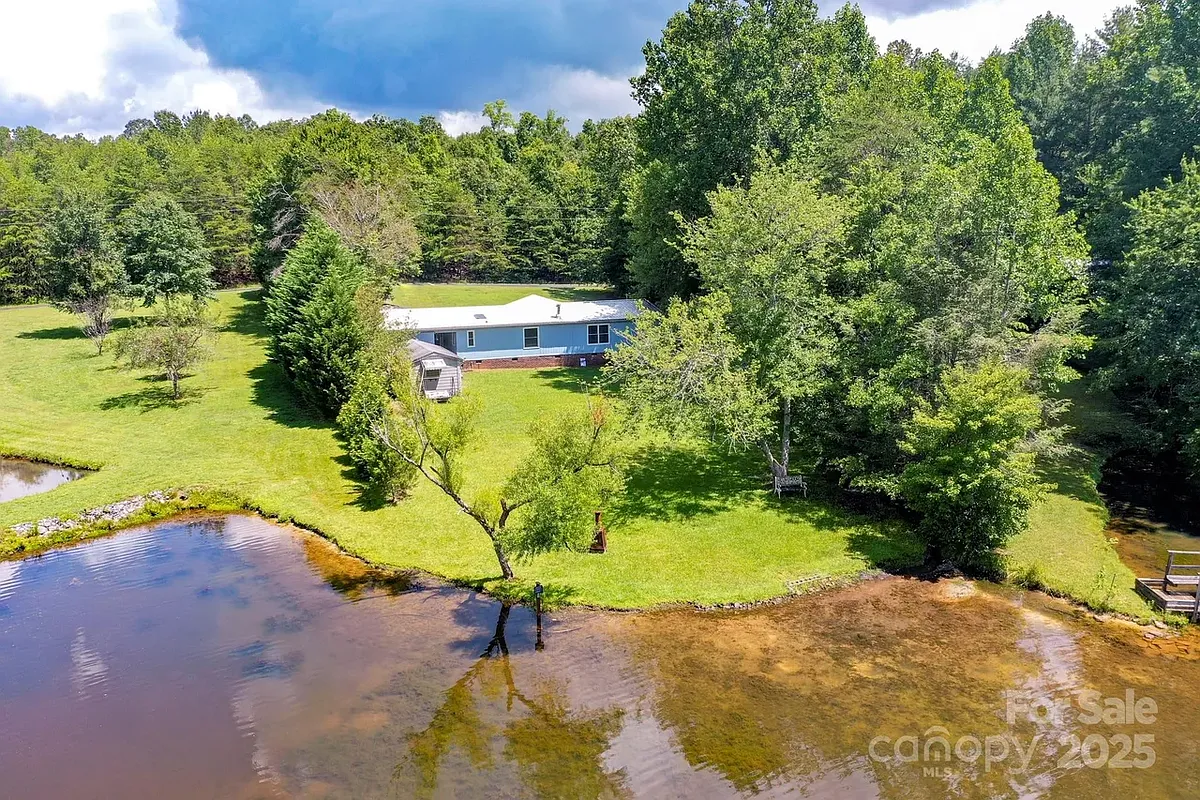 Photo 1 of 20 - 150 Navaho Trl - Rutherfordton, NC Amazing property with a beautiful back yard lake. - 150 Navaho Trl