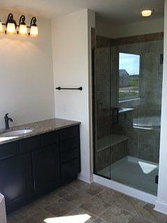Frameless shower in owners' bathroom