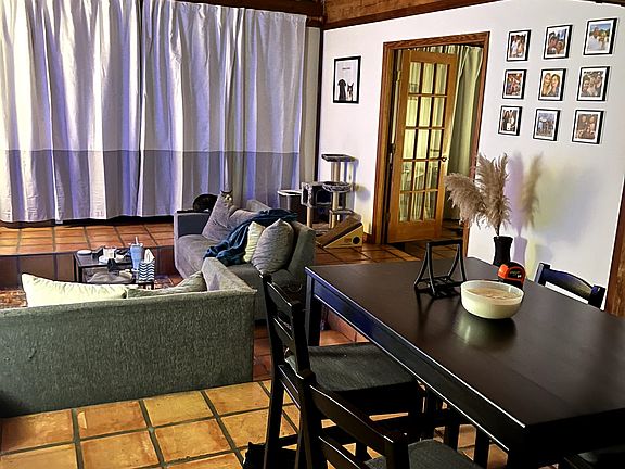 Open-concept living and dining area filled