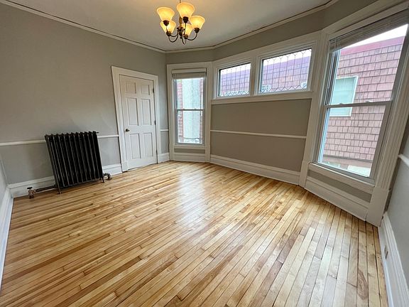 Dining room can double as fourth bedroom, refinished Maple floors, fresh paint, leaded glass windows, 9 1/2 foot ceilings