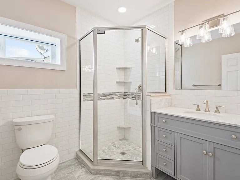New bathroom layout, radiant heated tiled floor (for those chill mornings), and new vanity with loads of light--both natural and LED