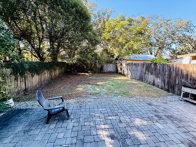 Big Fence in Back Yard house paved all around