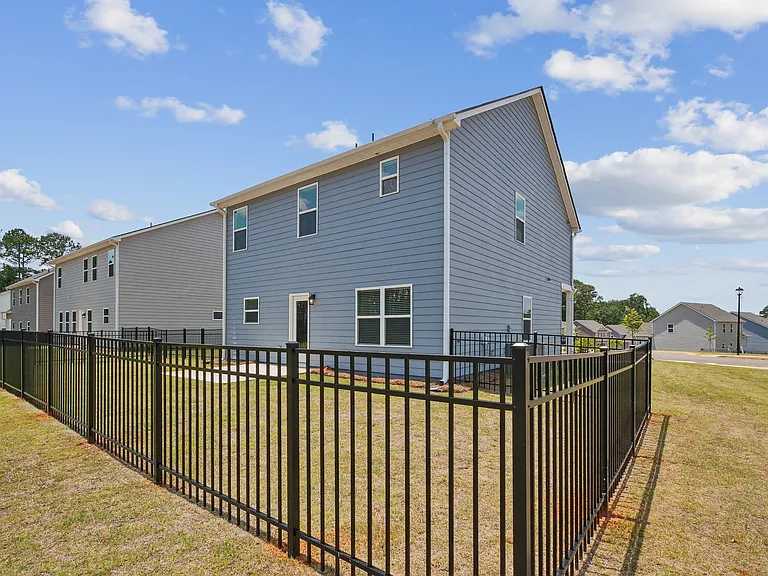 Another view of the back patio with fenced in yard.