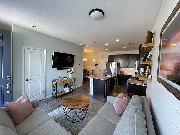 Open concept living room, kitchen, and dining room