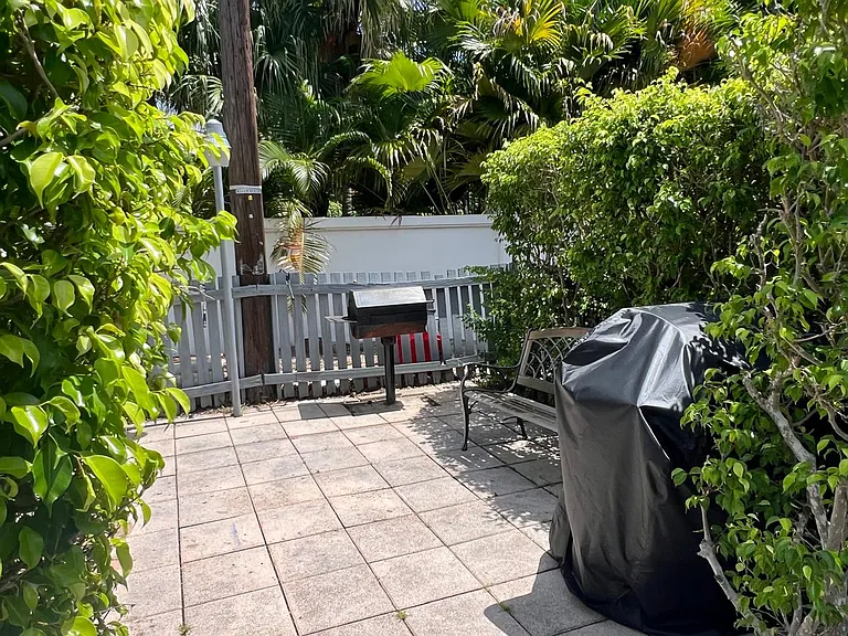 Grill area located across the pool.