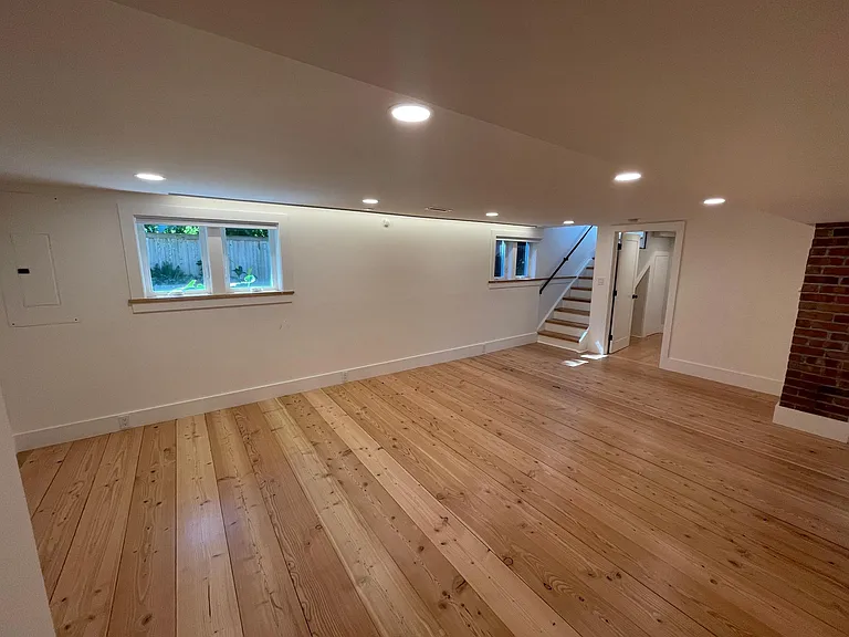 Media-room with exposed brick- and wood-work, home-cinema ready