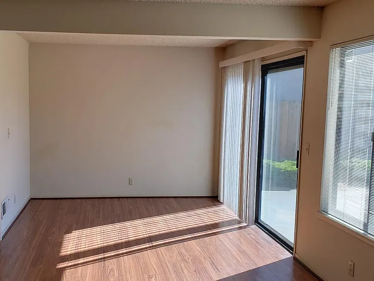Dining area (10' x 10') and glass sliding door to backyard