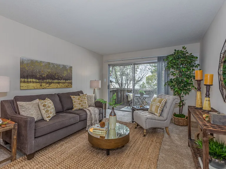 Open layout living room with access to private patio or balcony.