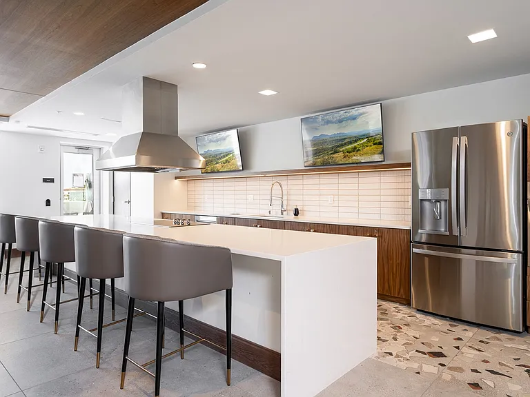 Our expansive clubroom includes a full chef's kitchen and walkout patio.