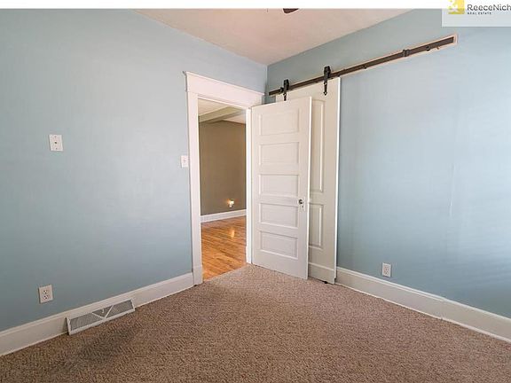 Other direction, bedroom 1.  Check out the barn doors for the closet!!