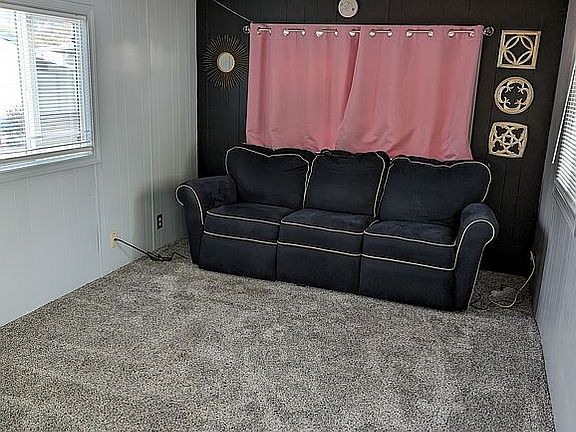 Great size living room! The lazy boy double reclining sofa can stay if you would like