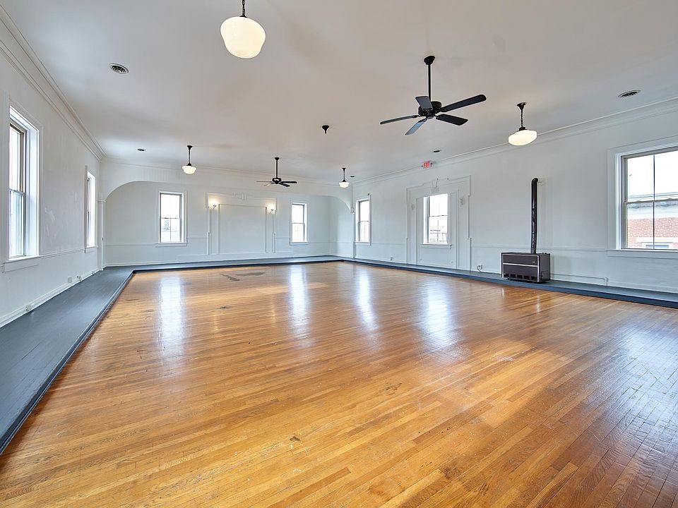 view from doorway of kitchen. can see2nd story historic building across college ave. Again notice nature lighting. Hardwood floor from early 1900's