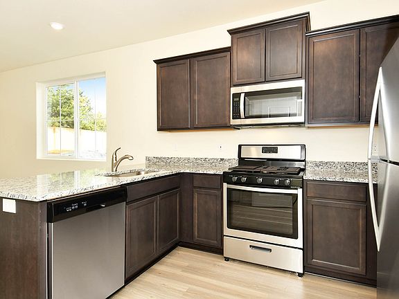 This home comes loaded with a full suite of energy-efficient kitchen appliances by Whirlpool.