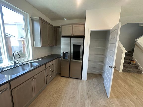 Large kitchen pantry with smart refrigerator