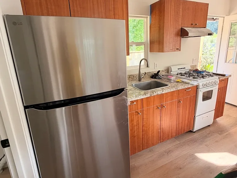 Brand new full size fridge. Nice window over sink that over looks the feild.