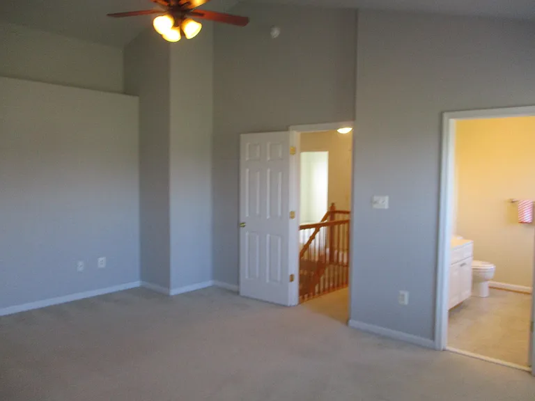 Owner's bedroom with vaulted ceiling, large walk in closet and private bathroom with shower stall and garden tub