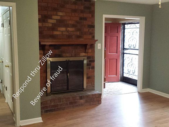 Den with wood burning fireplace (15' x 16')