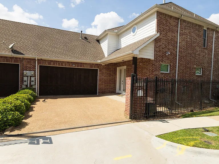 Spacious gated driveway with secure garage parking