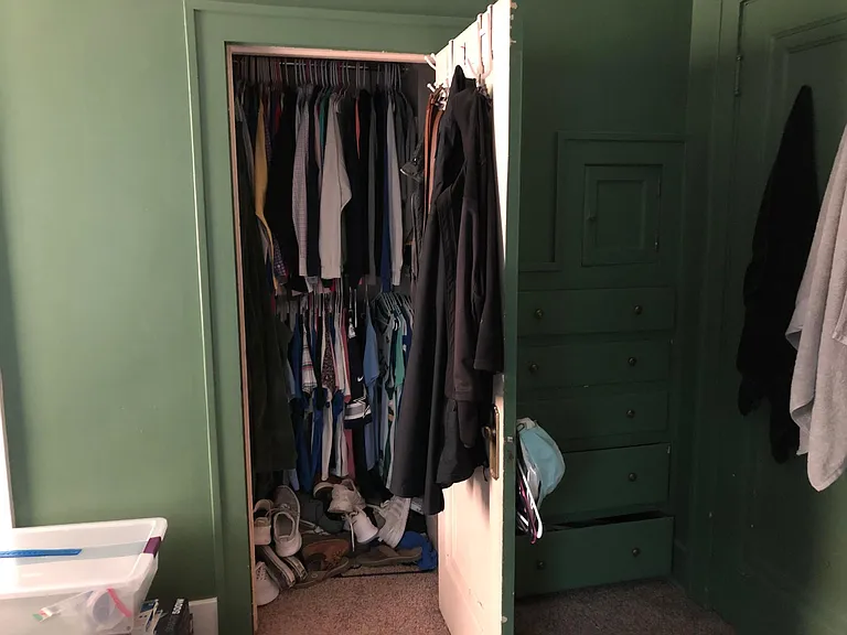 Main floor south closet and built in drawers to the right