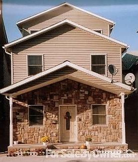 Front
						:
						Neutral stone and siding w/ outside electrical units for lights and decorations