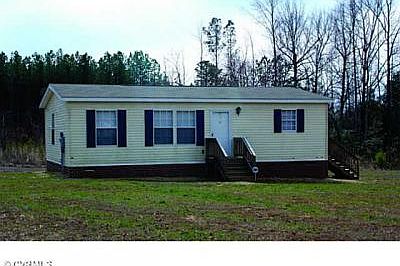 Great home on a large private lot surrounded by trees.