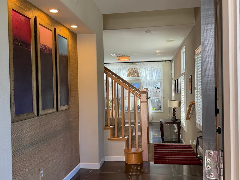 main door entry with living room in far background