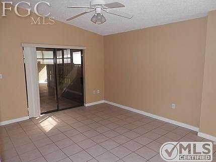 Livingroom with slider to screened patio.
