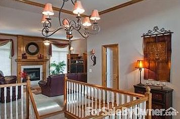 Front door lhrough to fire place
						:
						Night light on entry table and the garage entry is through this hallway at R.