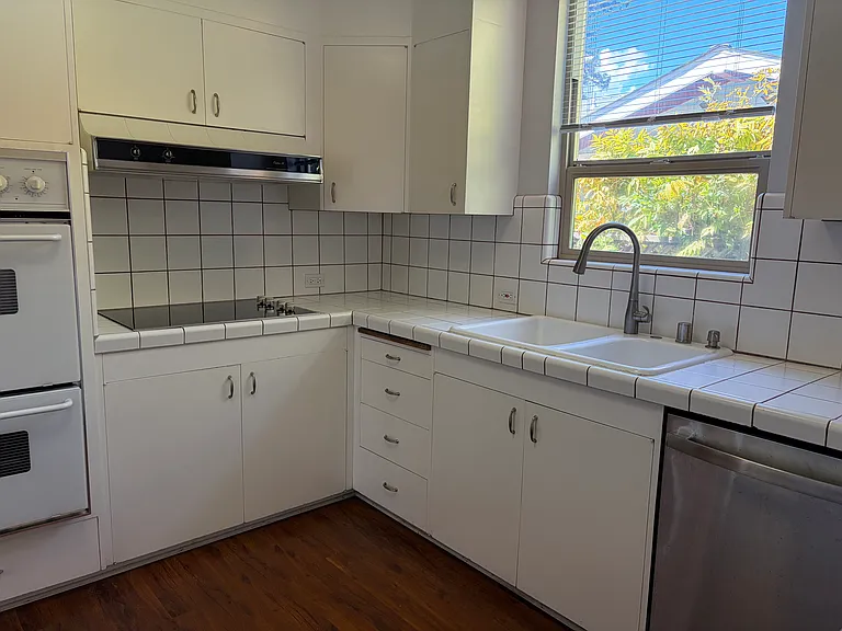 Kitchen has double wall ovens, newer dishwasher and electric glass cooktop. It also has an adjoining eat-in area