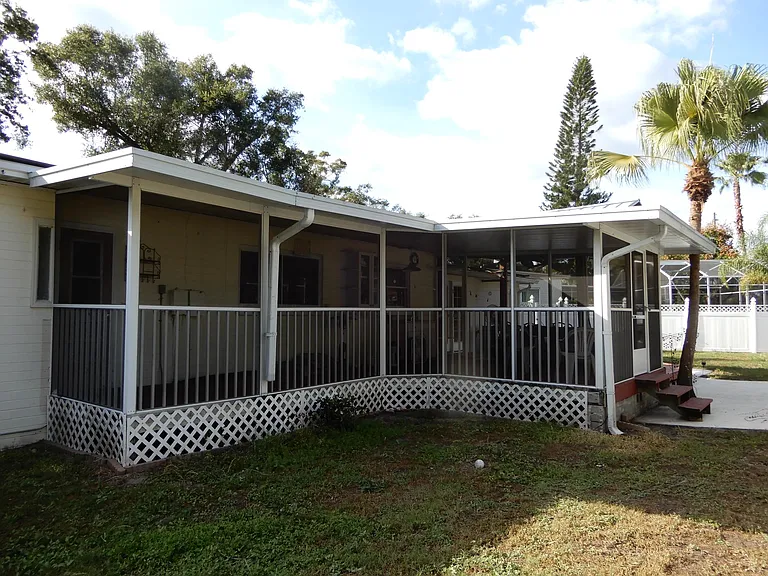 Attached raised Screened porch with outdoor sink and storage cabinet. Great for entertaining and just relaxing after a busy day.