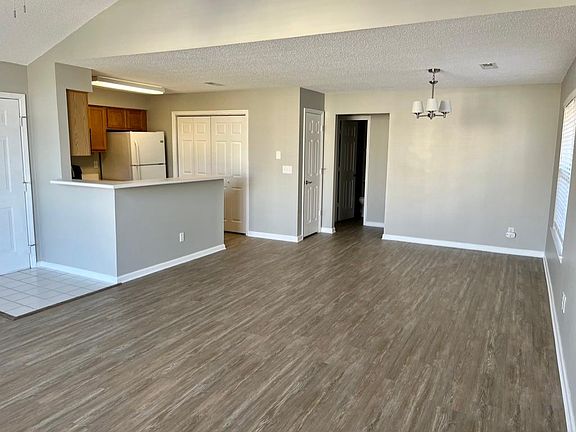 Dining Room and Kitchen. Kitchen includes a stove, microwave, dishwasher and refrigerator.