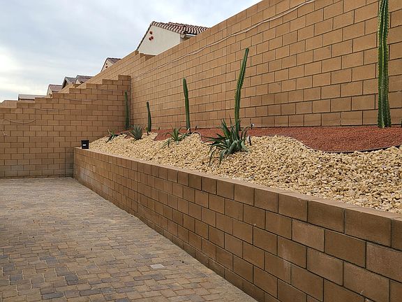 Backyard with pavers and desert landscape