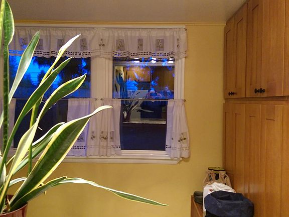 Sunroom with lots of cabinets. 